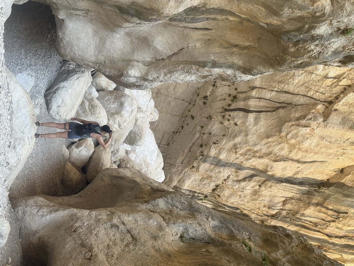 Egle hiking through a rocky gorge